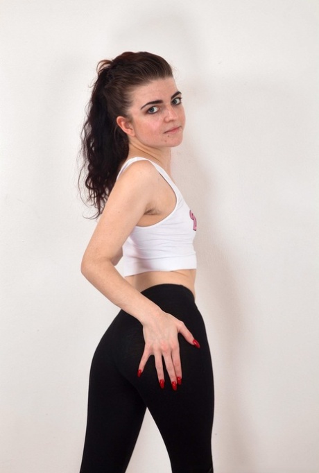 Solo girl Scarlet Contemptress pulls down black leggings to show her full bush 99135419