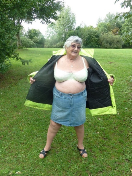 Fat British woman Grandma Libby exposes herself by a tree in a park 42334349