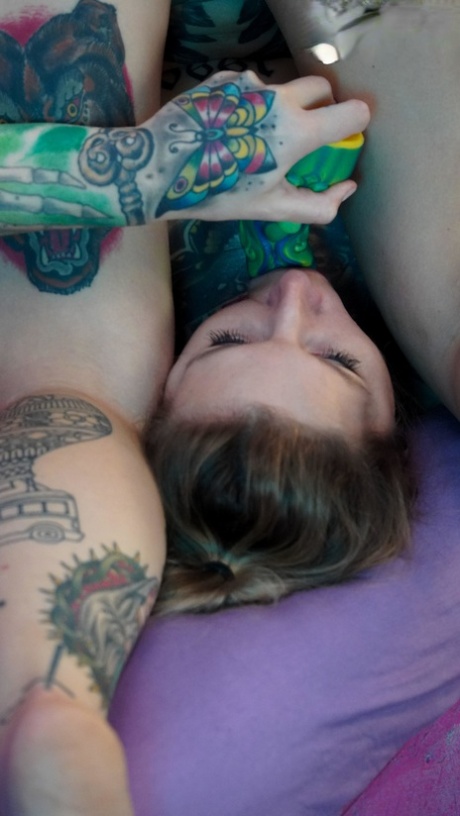Tattooed girl Lisa Rocketcock plays with a sex toy during sex with a boy 85299087