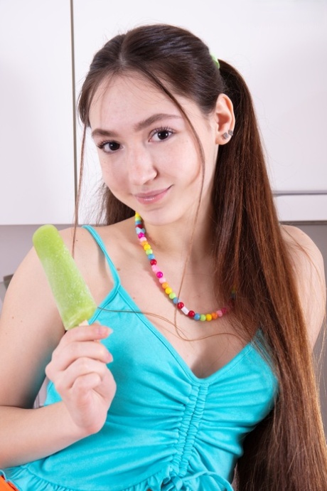 Charming teen Fendi eats a popsicle while getting bare naked in the kitchen 39102978